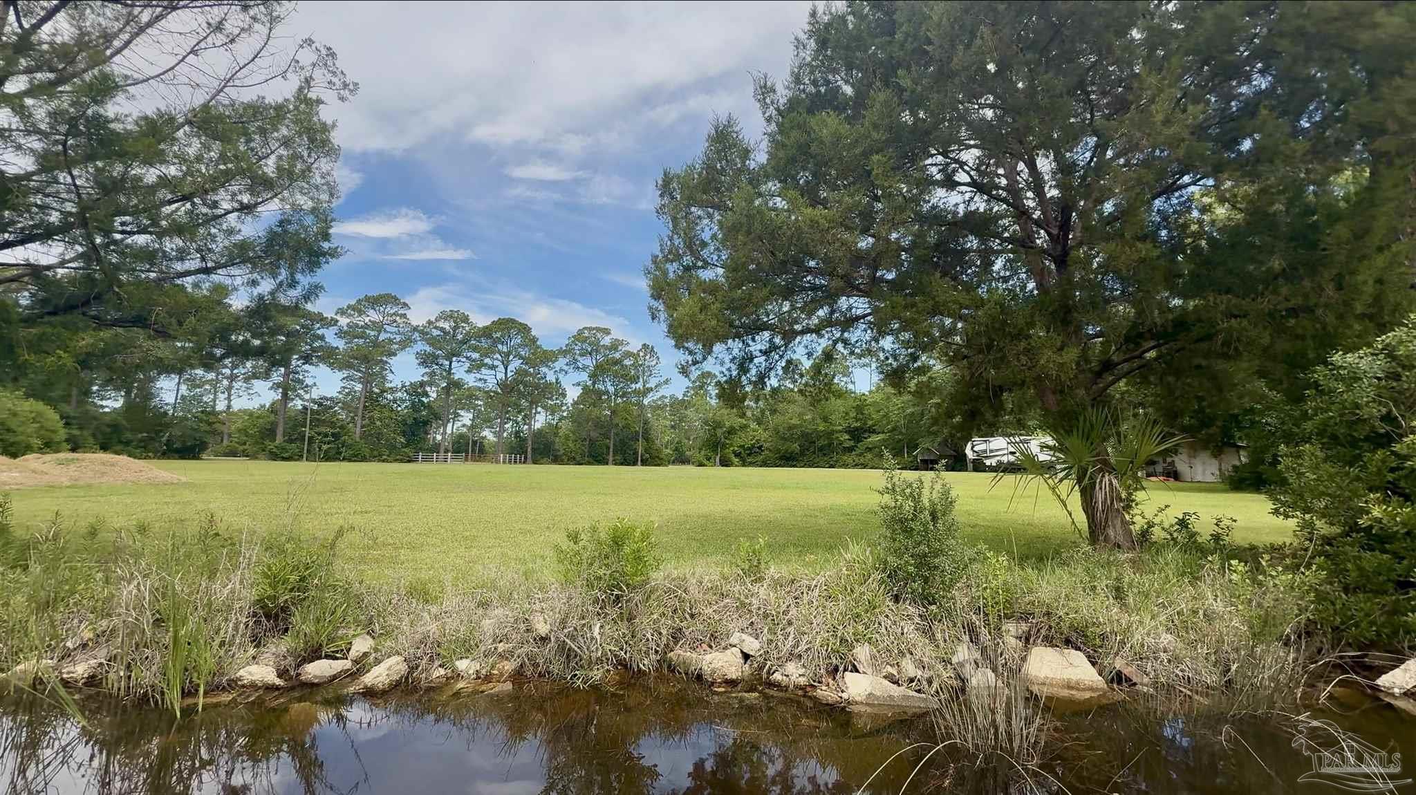7524 Petersen Point Road Milton, FL 32583 - Photo 8 of 26 a view of an outdoor space and a yard