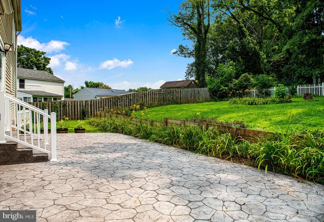 a view of a chair and table in the garden