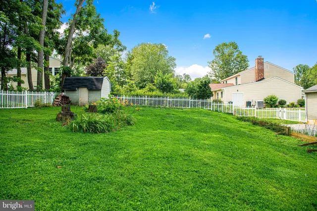 a view of a garden with houses