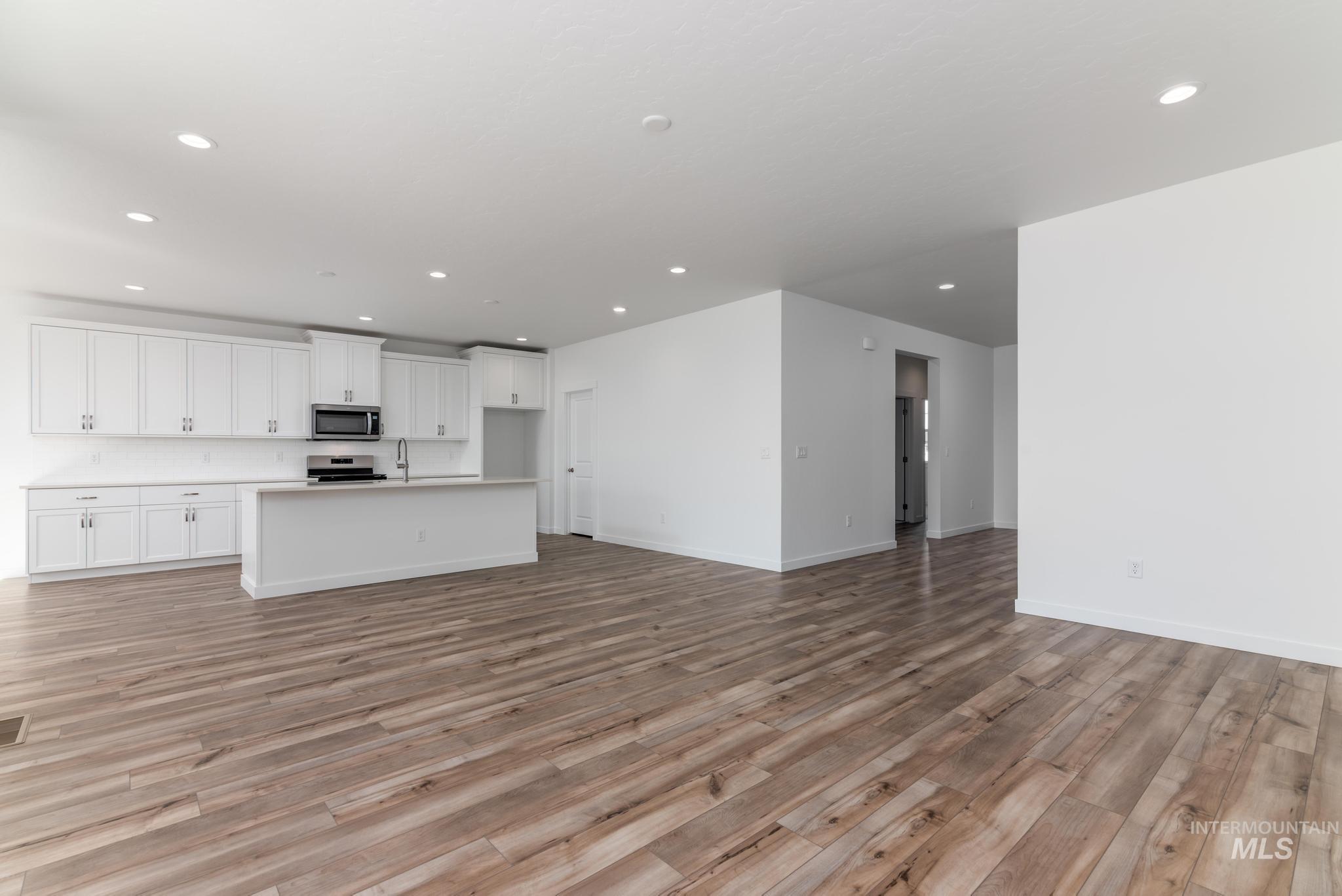 893 West Bay Street Middleton, ID 83644 - Photo 2 of 10 Unfurnished living room featuring light wood-style floors and recessed lighting