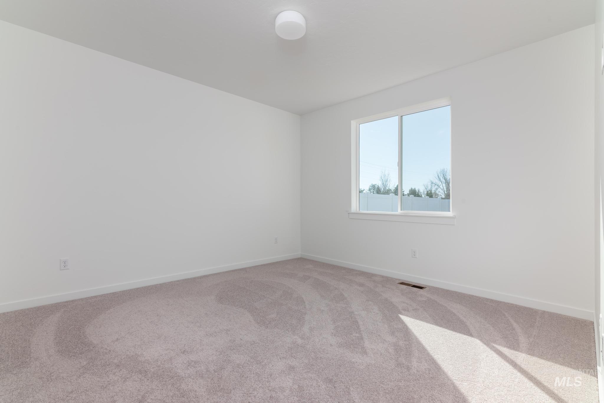 893 West Bay Street Middleton, ID 83644 - Photo 7 of 10 Carpeted empty room with baseboards