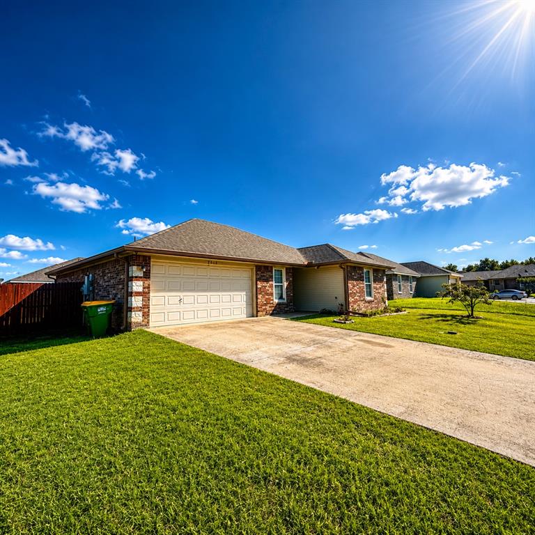 2003 Firefly Circle Waco, TX 76705 - Photo 7 of 29 Brick and stone exterior with a two-car garage