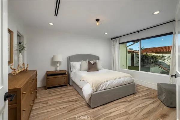 a living room with furniture a dining table and chairs