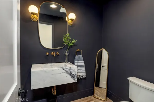 a view of a living room and bathroom with a bathtub