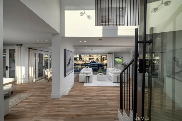 a bedroom with furniture and a large window