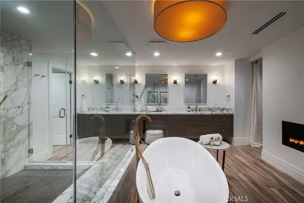 a spacious bedroom with a large bed and a couch