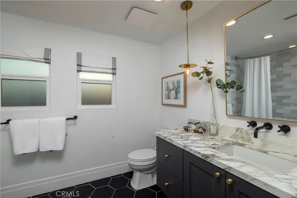 a view of hallway with stairs and wooden floor