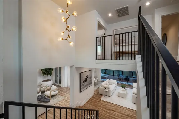 a living room with furniture and kitchen view