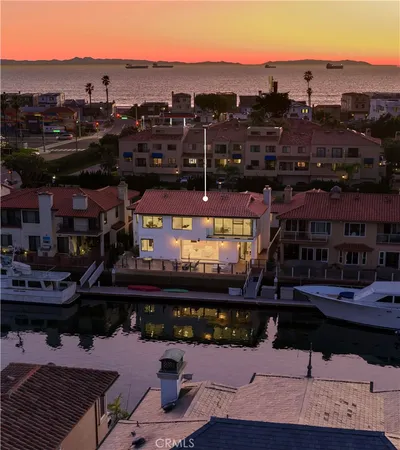 a view of a house with backyard tub and sitting area