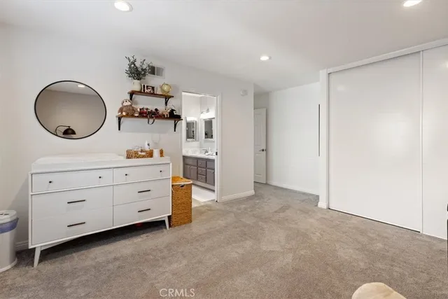 a room with a dresser and a mirror