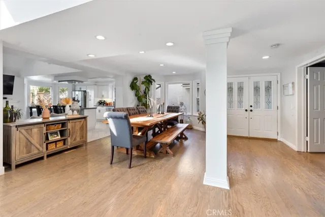 a view of a dining area with furniture and wooden floor