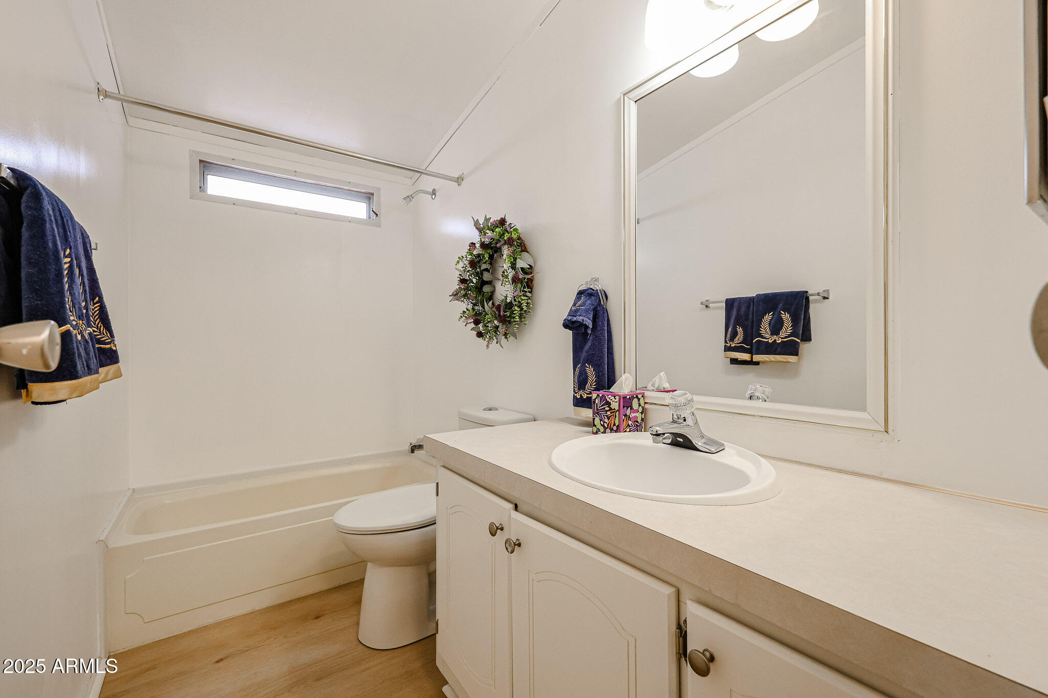 3901 East Pinnacle Peak Road, Unit 36 Phoenix, AZ 85050 - Photo 14 of 26 a bathroom with a sink a toilet and shower curtain