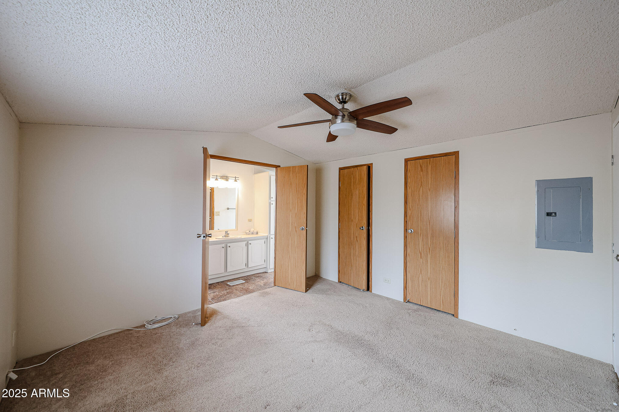 3901 East Pinnacle Peak Road, Unit 36 Phoenix, AZ 85050 - Photo 16 of 26 a view of a livingroom with a ceiling fan and window