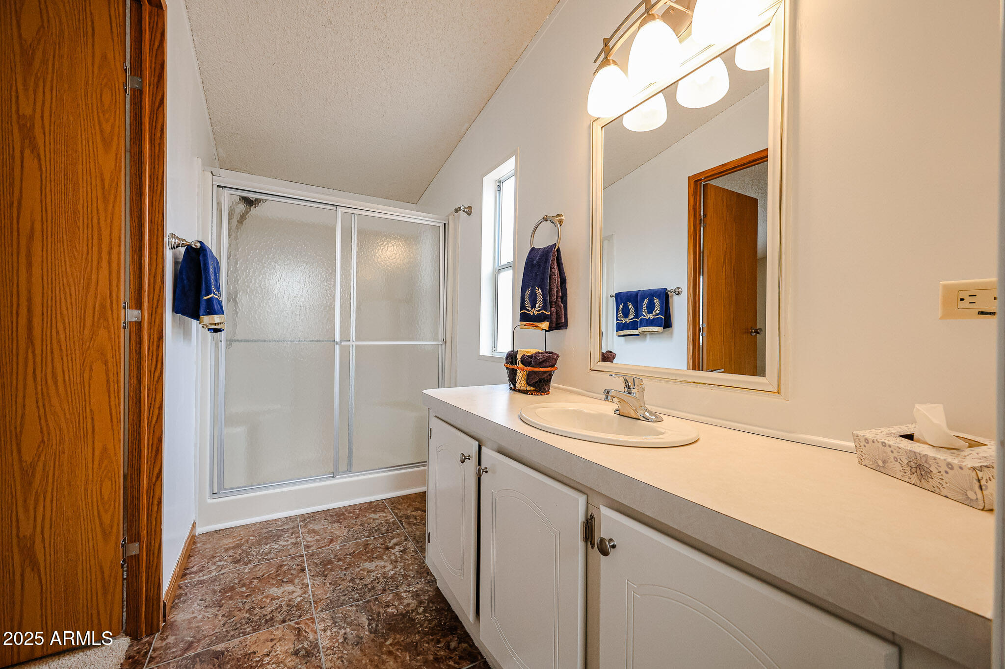 3901 East Pinnacle Peak Road, Unit 36 Phoenix, AZ 85050 - Photo 19 of 26 a bathroom with a sink and a mirror