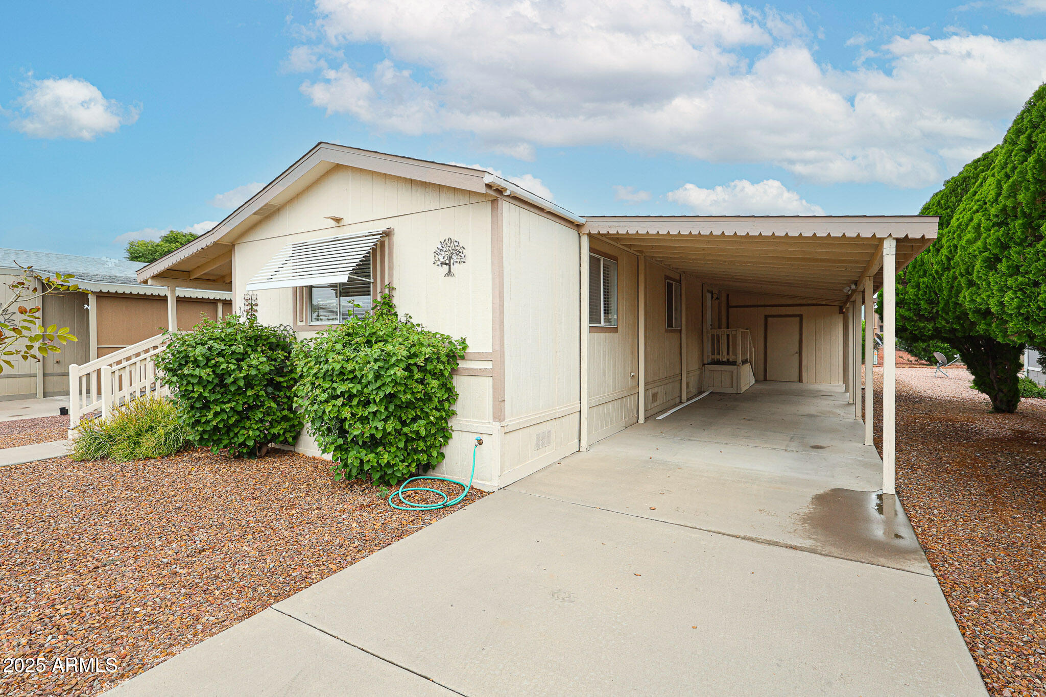 3901 East Pinnacle Peak Road, Unit 36 Phoenix, AZ 85050 - Photo 22 of 26 a view of a house with a yard