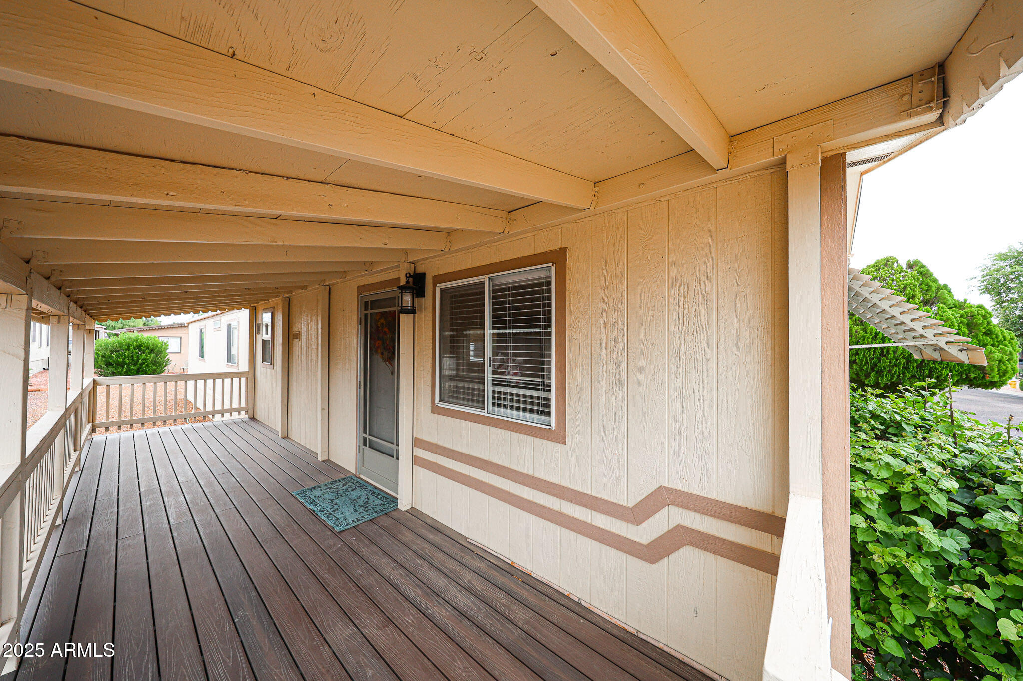3901 East Pinnacle Peak Road, Unit 36 Phoenix, AZ 85050 - Photo 3 of 26 a view of backyard with a deck and wooden floor