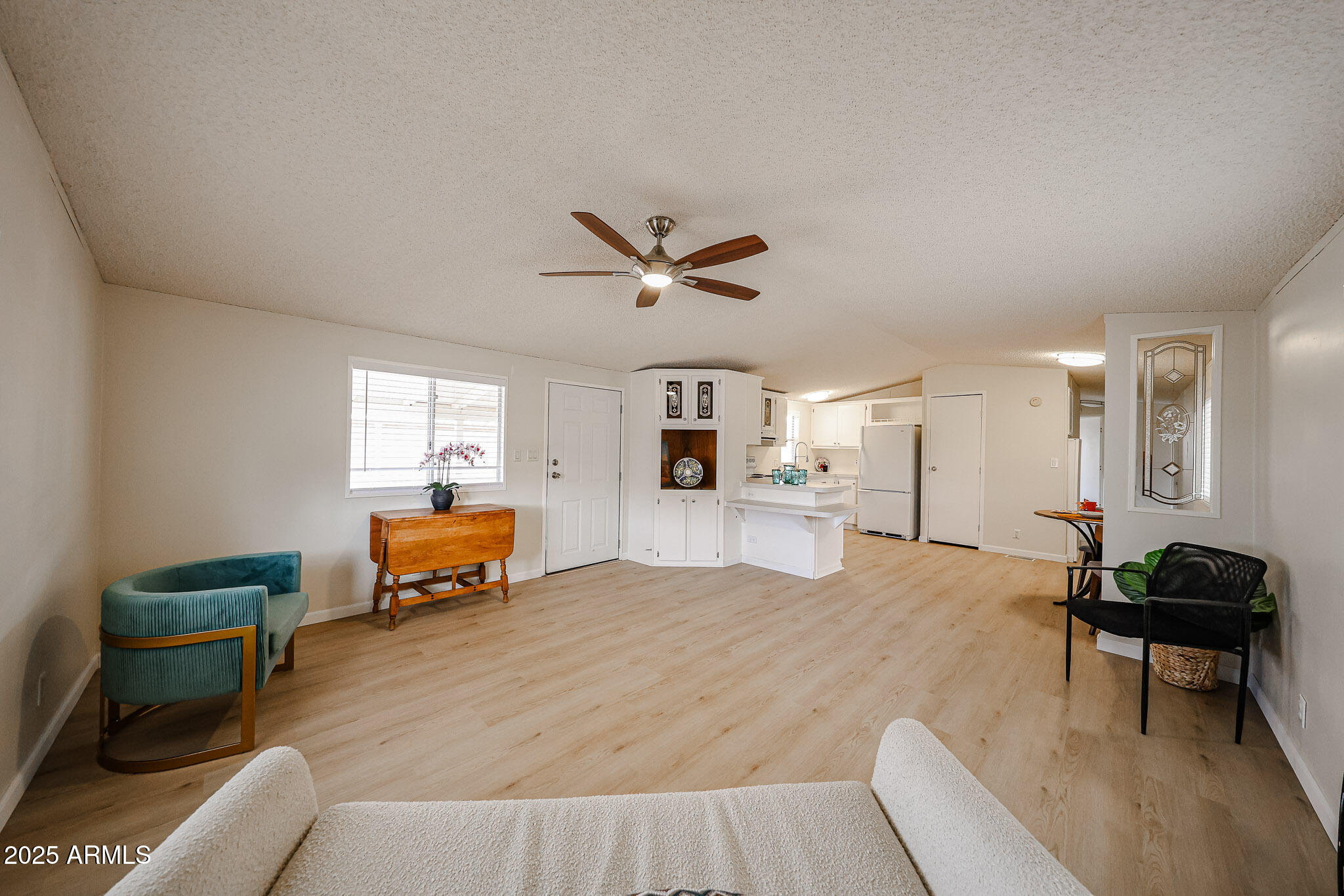 3901 East Pinnacle Peak Road, Unit 36 Phoenix, AZ 85050 - Photo 5 of 26 a living room with furniture and wooden floor