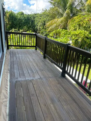 a view of deck with a floor to ceiling window