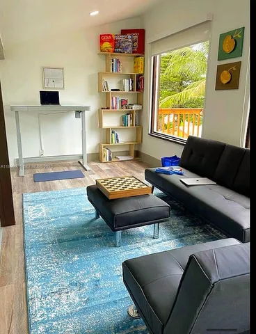 a living room with furniture and a window
