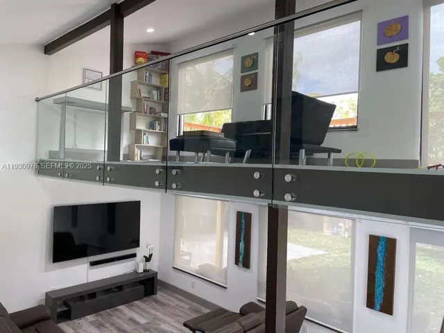 a bathroom with a sink a mirror and a shower