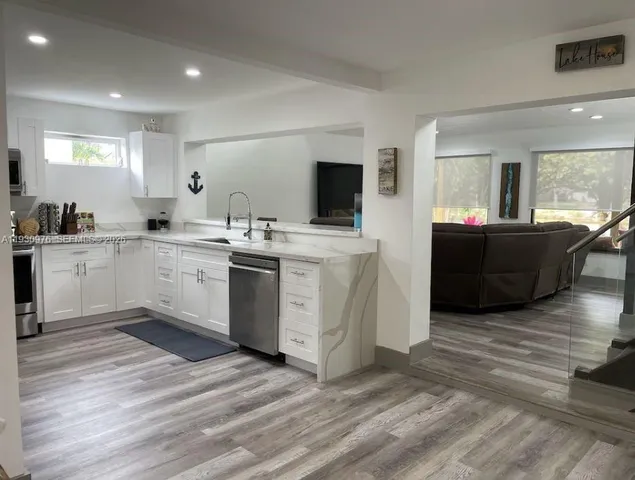 a kitchen with a sink and cabinets