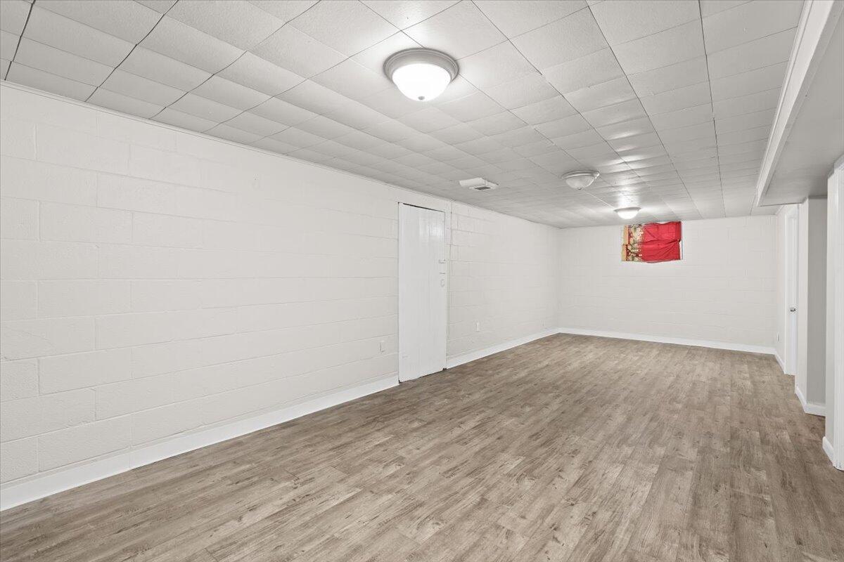 3642 Buchanan Street Gary, IN 46408 - Photo 22 of 25 an empty room with wooden floor and windows