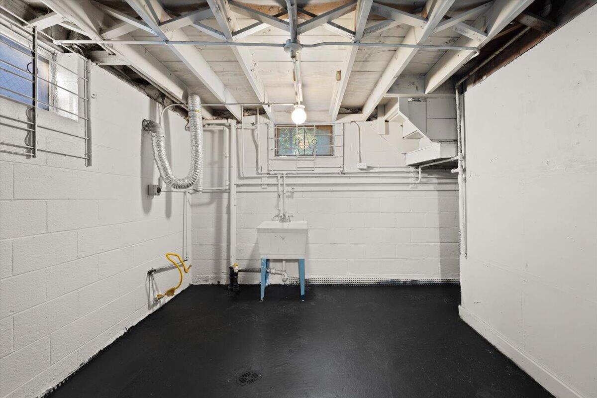 3642 Buchanan Street Gary, IN 46408 - Photo 23 of 25 a view of storage and utility room with racks on the wall