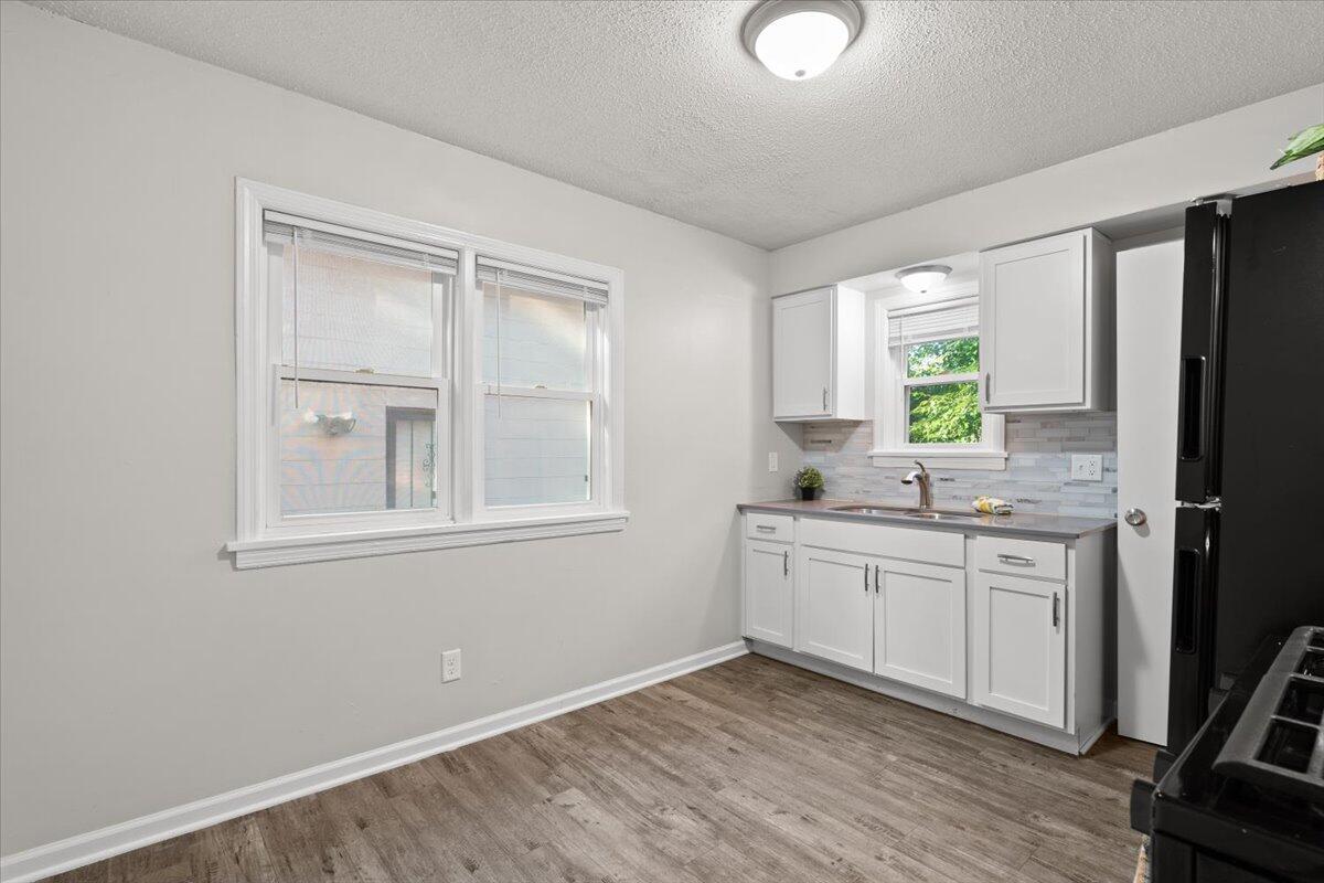 3642 Buchanan Street Gary, IN 46408 - Photo 9 of 25 a view of a kitchen counter space and windows