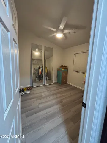 a en suite bathroom with a double vanity sink and a mirror