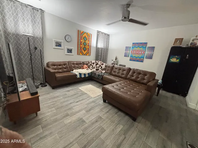 a lobby with furniture and a potted plant