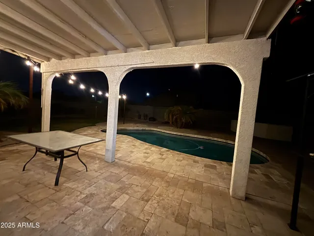 a living room with a couch and a stove top oven