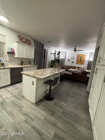 a bedroom with furniture and a flat screen tv