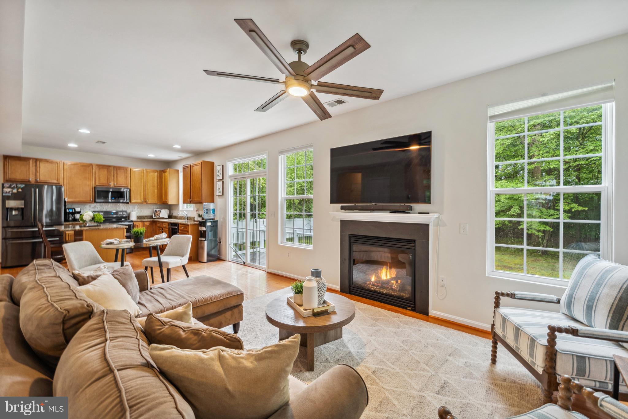 1407 James Way Edgewater, MD 21037 - Photo 11 of 30 a living room with furniture fireplace and a large window
