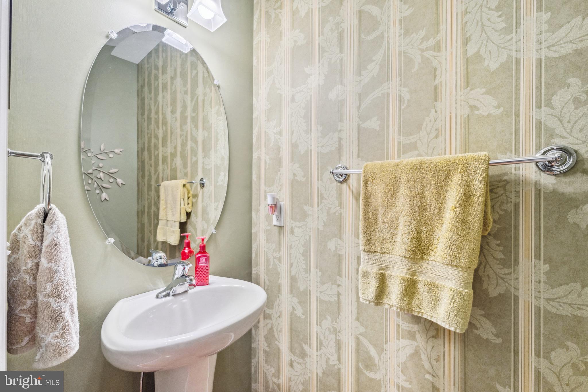 1407 James Way Edgewater, MD 21037 - Photo 13 of 30 a bathroom with a sink and a mirror