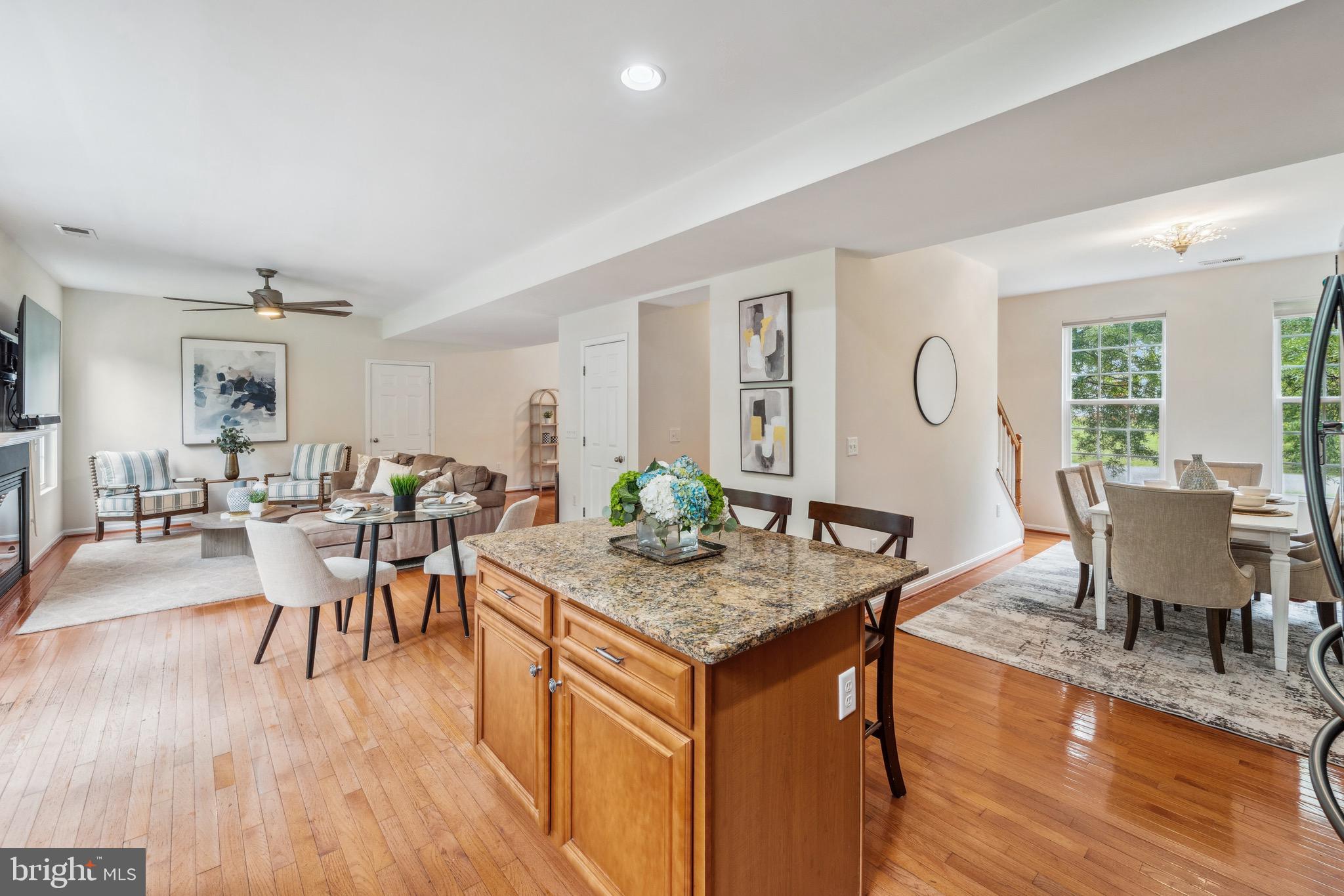 1407 James Way Edgewater, MD 21037 - Photo 15 of 30 a view of a dining room with furniture and wooden floor