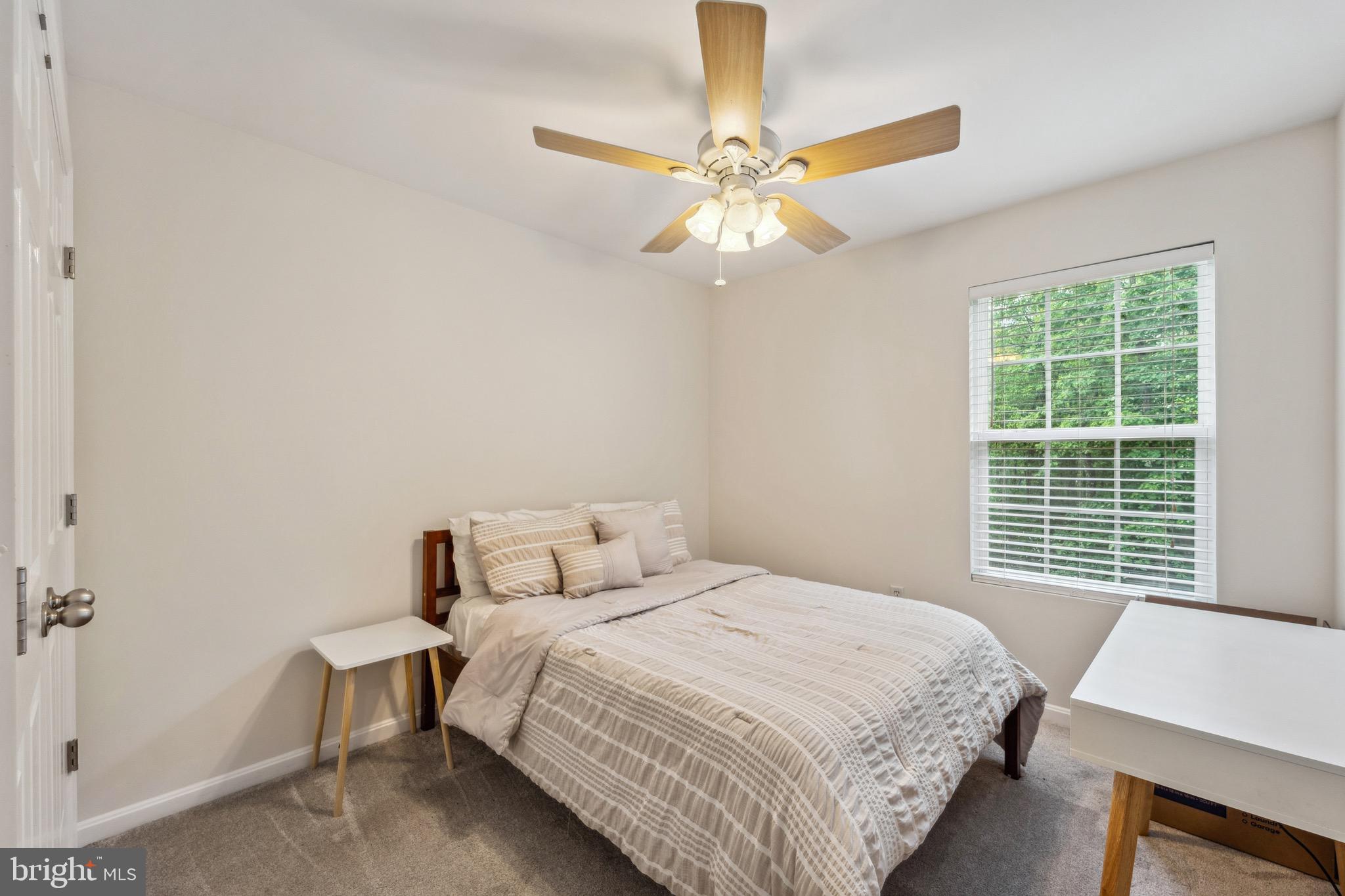 1407 James Way Edgewater, MD 21037 - Photo 21 of 30 a bedroom with a bed and a window