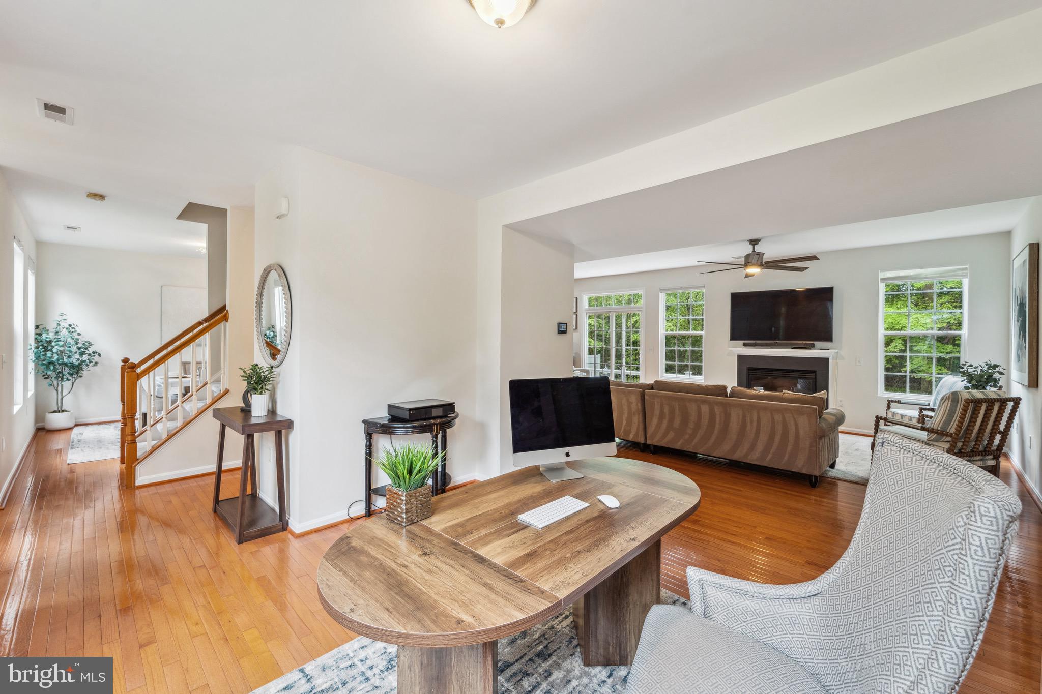 1407 James Way Edgewater, MD 21037 - Photo 6 of 30 a living room with furniture a flat screen tv and a fireplace