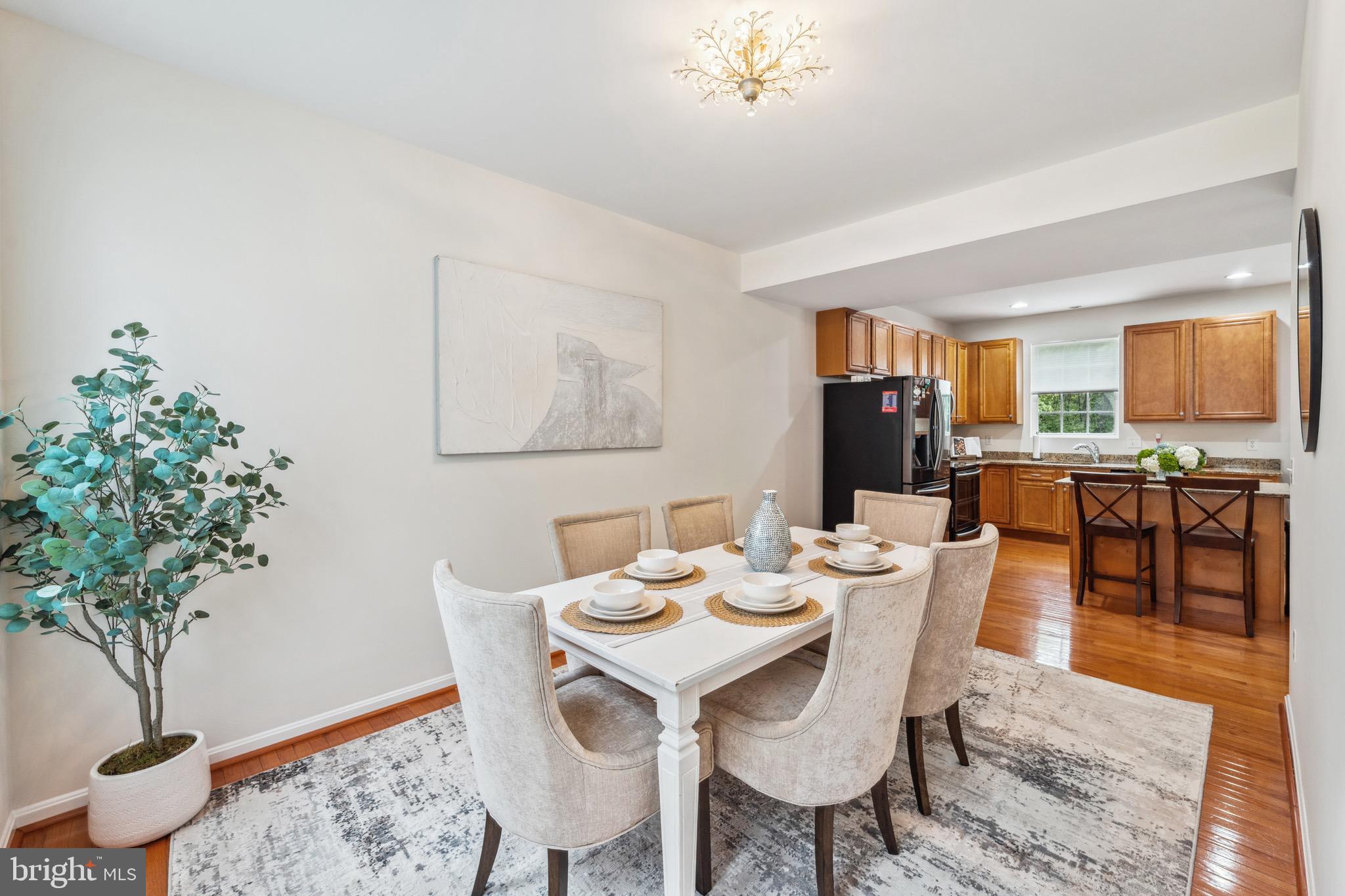 1407 James Way Edgewater, MD 21037 - Photo 8 of 30 a view of a dining room with furniture and wooden floor