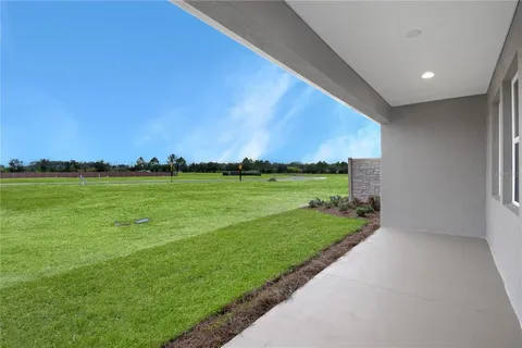 a view of a golf course with a big yard