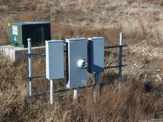 a picture of a house with a yard and fence