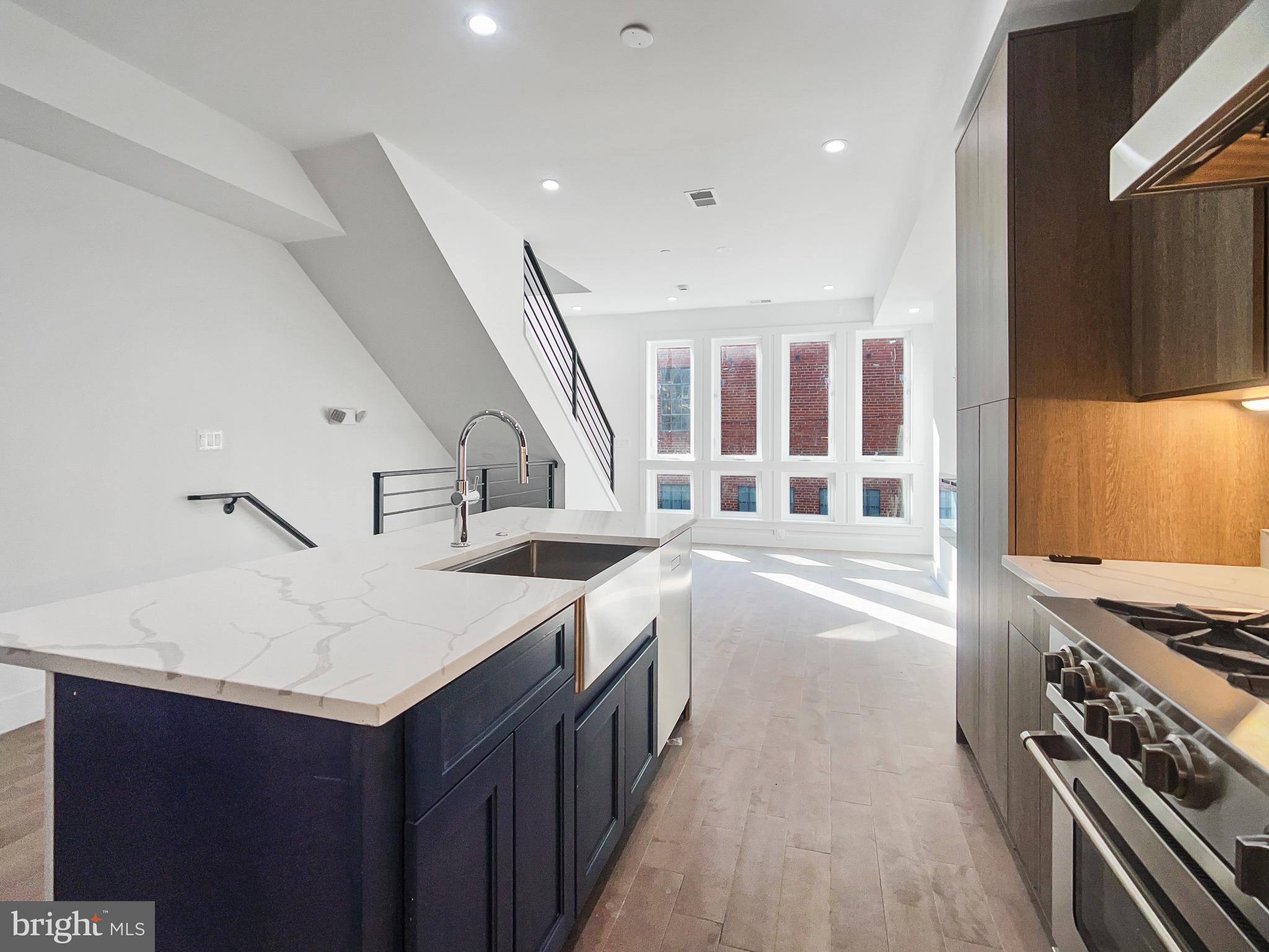 2228 13th Street Northwest, Unit 3 Washington, DC 20009 - Photo 12 of 44 Modern kitchen with sleek design and light.
