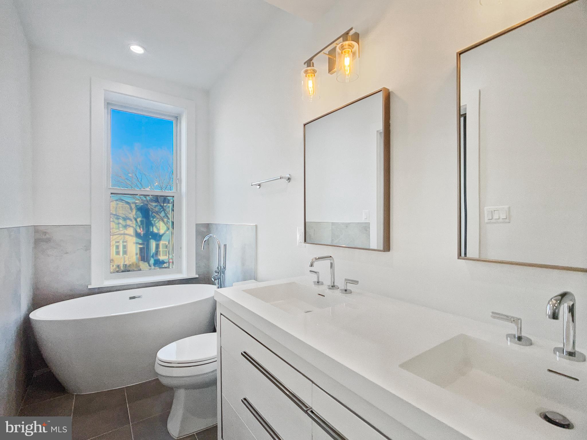 2228 13th Street Northwest, Unit 3 Washington, DC 20009 - Photo 20 of 44 Sleek modern bathroom with natural light.