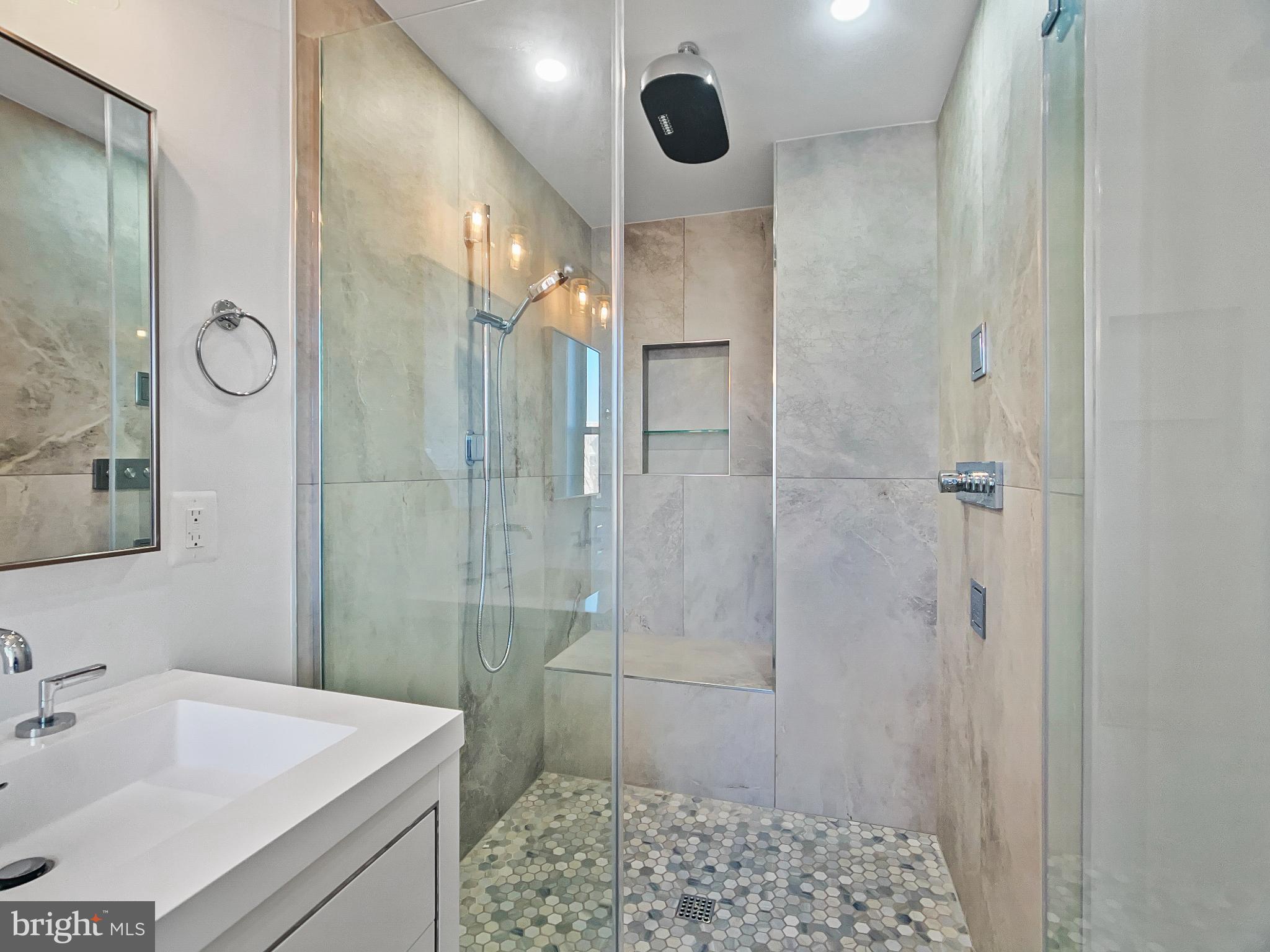 2228 13th Street Northwest, Unit 3 Washington, DC 20009 - Photo 22 of 44 Sleek modern shower with elegant finishes.