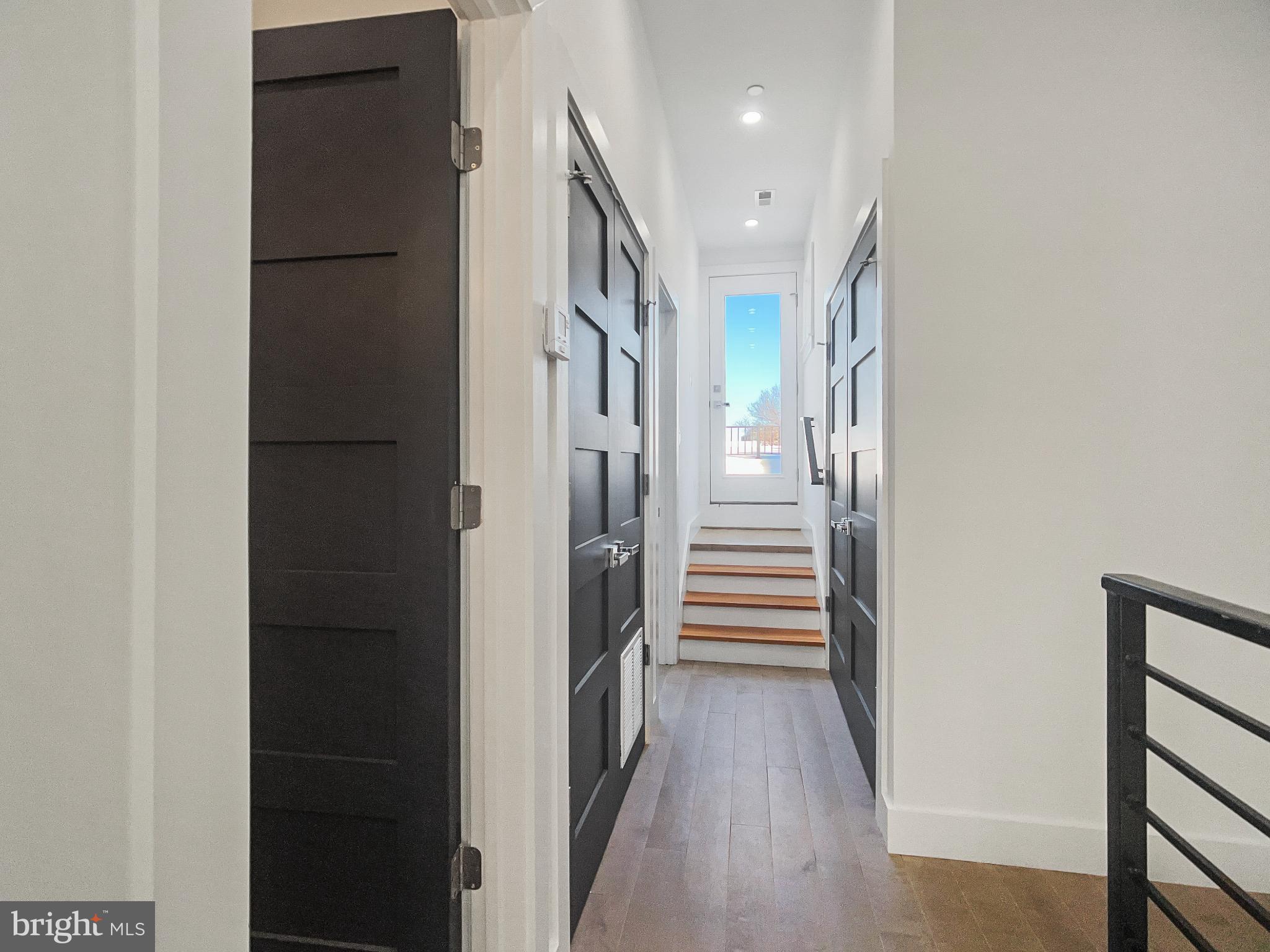 2228 13th Street Northwest, Unit 3 Washington, DC 20009 - Photo 28 of 44 Modern hallway with sleek black doors.
