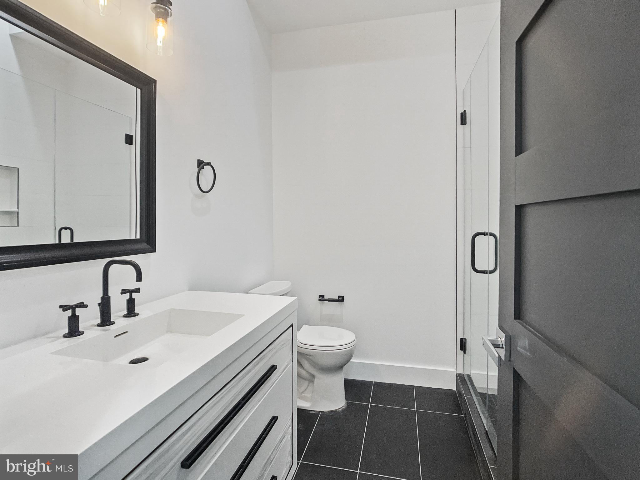 2228 13th Street Northwest, Unit 3 Washington, DC 20009 - Photo 33 of 44 Sleek modern bathroom with elegant finishes.