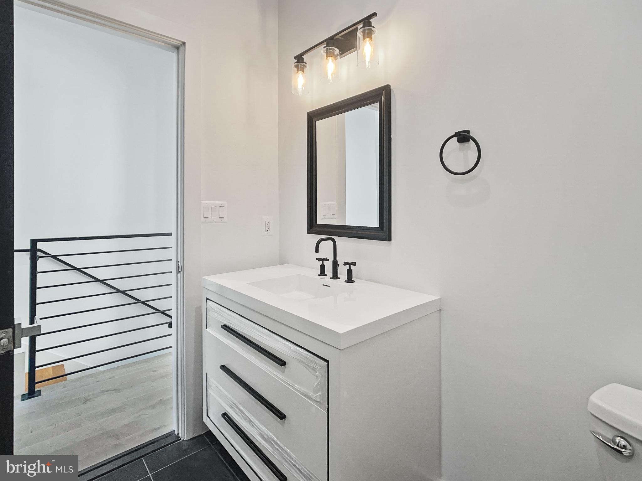 2228 13th Street Northwest, Unit 3 Washington, DC 20009 - Photo 34 of 44 Sleek modern bathroom with stylish fixtures.