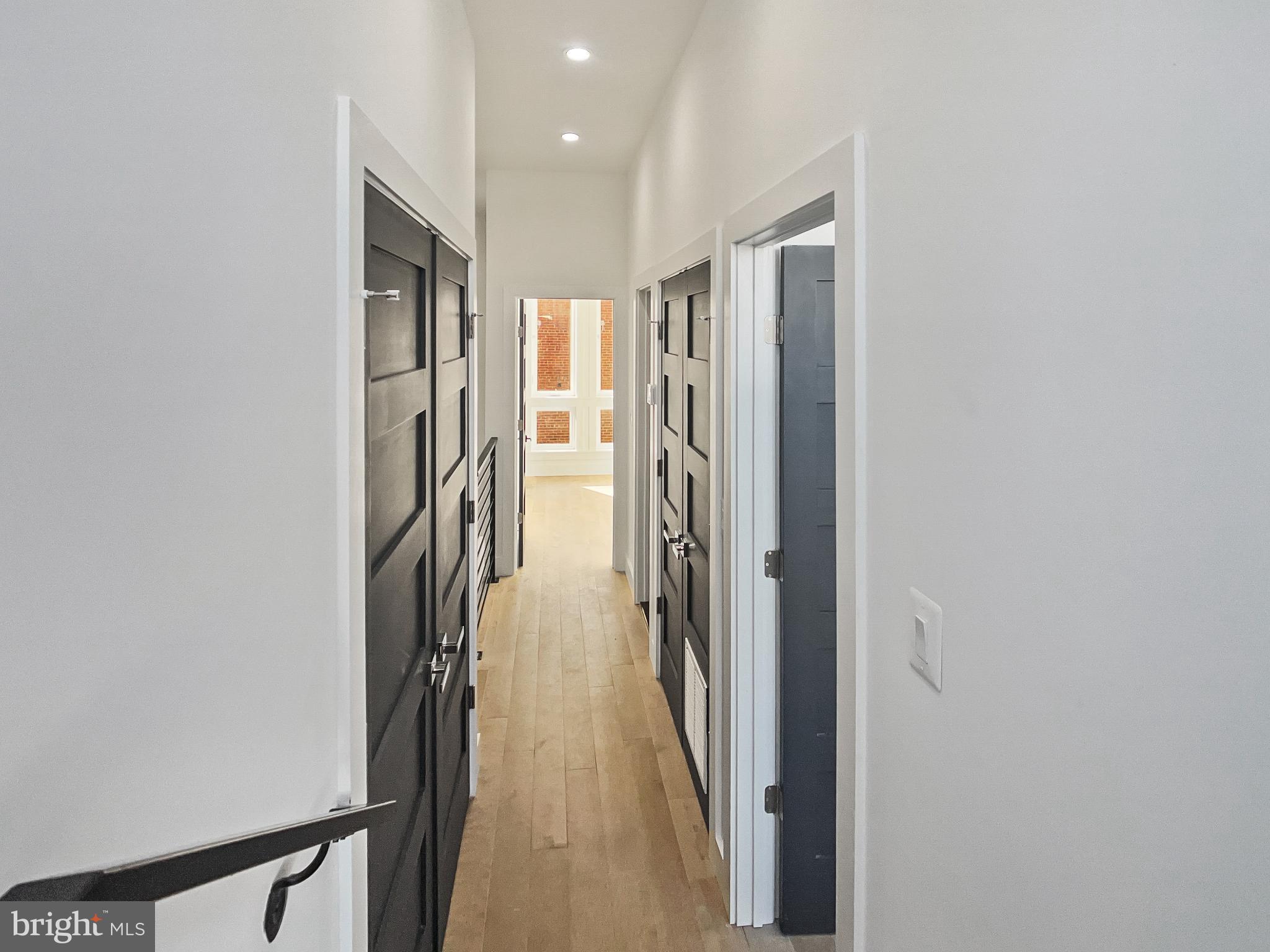 2228 13th Street Northwest, Unit 3 Washington, DC 20009 - Photo 38 of 44 Modern hallway with sleek doors and light.