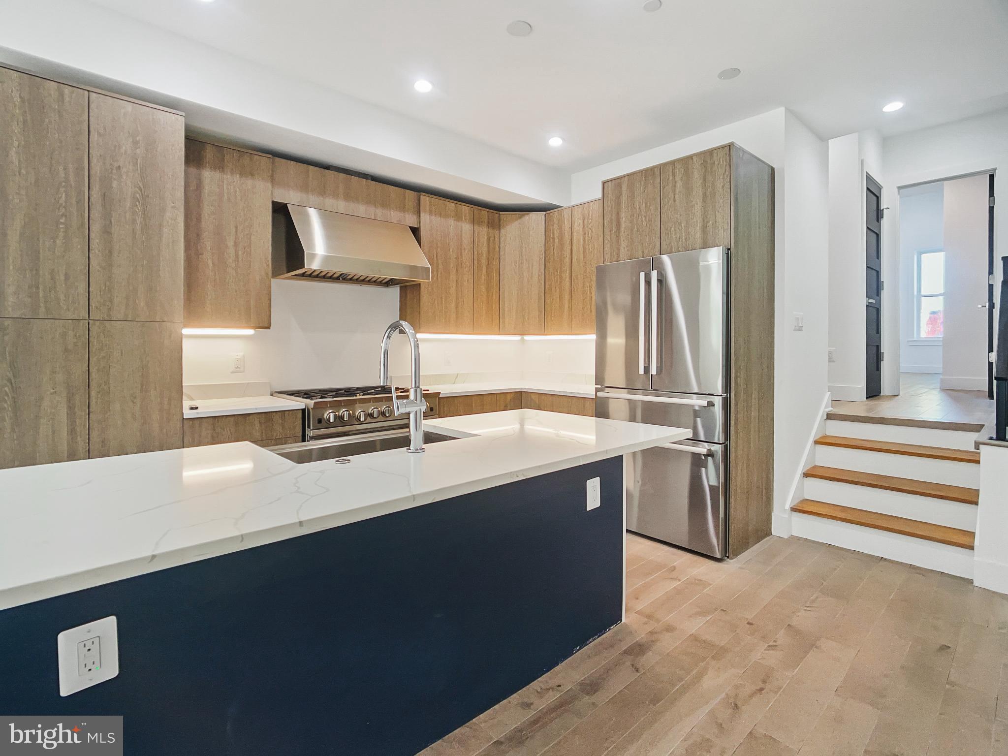 2228 13th Street Northwest, Unit 3 Washington, DC 20009 - Photo 4 of 44 Sleek modern kitchen with elegant finishes.