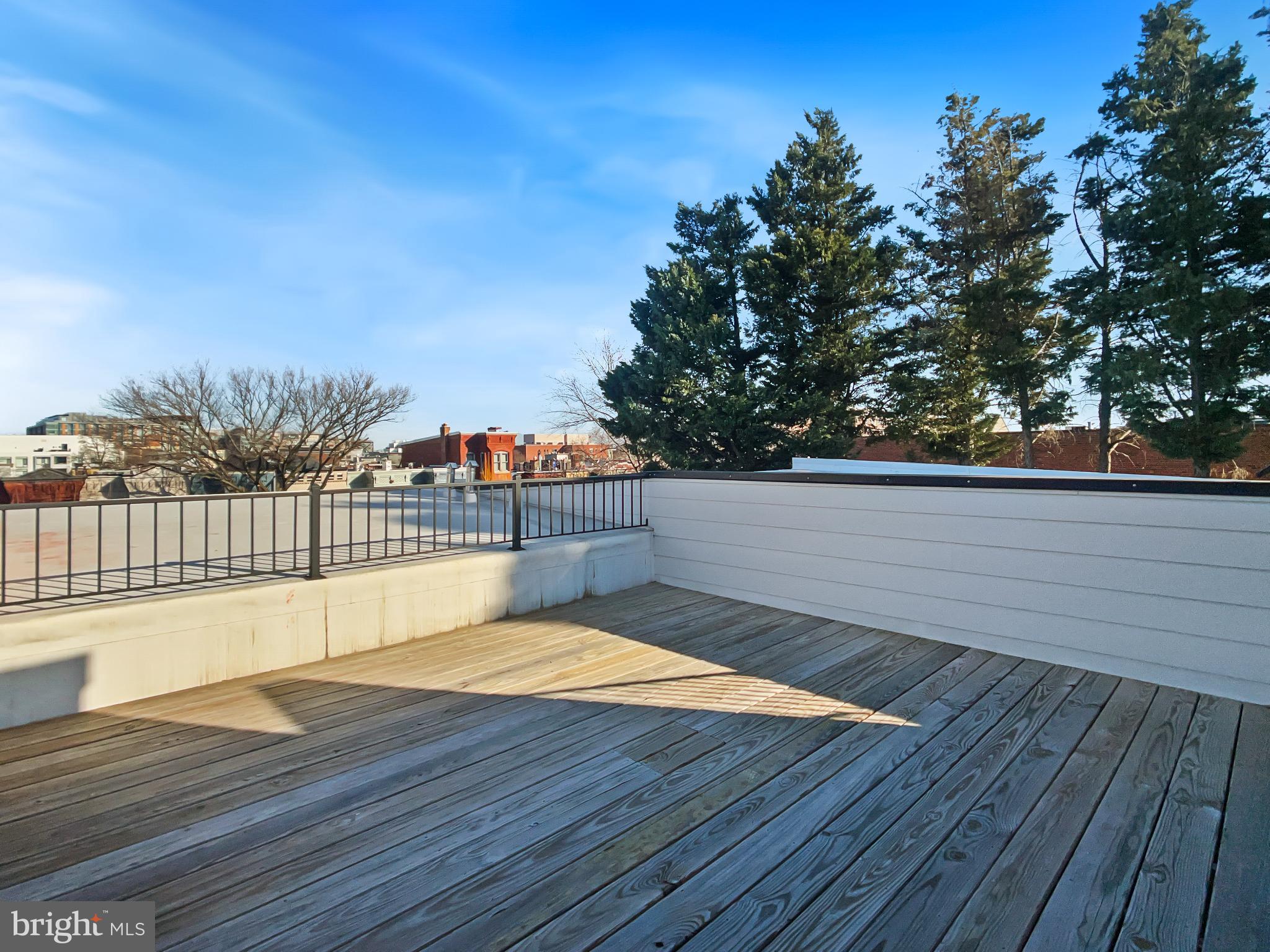 2228 13th Street Northwest, Unit 3 Washington, DC 20009 - Photo 42 of 44 Sunny rooftop retreat with city views.