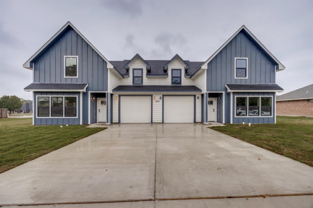 a view of a yard in front of a house with a yard